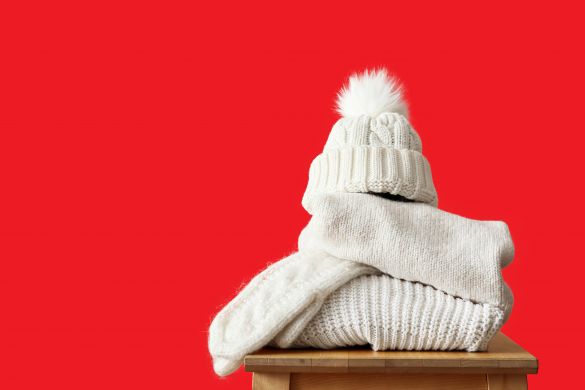 Winter clothes on red background