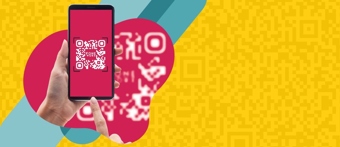 hand holding phone scanning a QR code